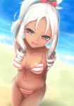  1girl :d alternate_hair_color arms_behind_back beach bikini blurry blush bow breasts breasts_apart brown_eyes collarbone depth_of_field drill_hair eromanga_sensei eyebrows_visible_through_hair front-tie_bikini front-tie_top hair_bow head_tilt highres loussier666 medium_breasts navel open_mouth pointy_ears red_bow sand smile solo standing striped striped_bikini swimsuit tan thigh_gap water white_hair yamada_elf 