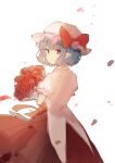  1girl bangs blue_hair bouquet bow closed_mouth collared_shirt cowboy_shot dress dress_shirt eyebrows_visible_through_hair flower from_behind ginryuu hat hat_bow highres holding holding_bouquet looking_at_viewer looking_back mob_cap petals pointy_ears puffy_short_sleeves puffy_sleeves red_bow red_dress red_eyes red_flower red_rose remilia_scarlet rose shirt short_hair short_sleeves simple_background skirt skirt_set smile solo touhou twisted_neck white_background white_shirt wind 