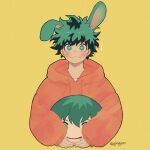  ! 1boy animal_ears artist_name blush boku_no_hero_academia bright_pupils character_doll closed_mouth commentary_request cropped_torso freckles gaagyeo green_eyes green_hair highres holding holding_stuffed_toy hood hood_down hoodie korean_commentary long_sleeves looking_at_viewer male_focus midoriya_izuku orange_hoodie rabbit_ears short_hair simple_background solo stuffed_toy twitter_username upper_body white_pupils yellow_background 