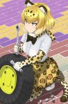  1girl animal_ears blonde_hair blush bow bowtie elbow_gloves fur_collar gloves highres holding ichinose_rokujo jaguar_(kemono_friends) jaguar_ears jaguar_print jaguar_tail kemono_friends looking_to_the_side shirt short_hair short_sleeves skirt solo squatting tail tire wrench yellow_eyes 