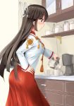  1girl ass black_hair blouse coffee_maker_(object) cowboy_shot cup cupboard drawer dress_shirt hair_ribbon hakama hand_on_hip highres hime_cut hiyou_(kantai_collection) japanese_clothes kantai_collection long_hair magatama mug one-piece_swimsuit profile red_eyes ribbon shirt solo swimsuit takaoka_nanase white_ribbon 