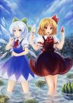  2girls black_skirt black_vest blonde_hair blue_dress blue_eyes blue_hair blue_sky cirno cravat day dress food frog fruit hair_ribbon hands_up highres lily_pad looking_at_viewer multiple_girls open_mouth outdoors popsicle puffy_short_sleeves puffy_sleeves red_eyes ribbon rumia sharp_teeth short_hair short_sleeves skirt skirt_set sky standing suzutaka_(ringo_kakigoori) teeth touhou tree vest wading watermelon watermelon_bar wings 