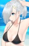  10s 1girl alternate_hairstyle bikini black_bikini blue_eyes breasts collarbone hair_ornament hair_over_one_eye hairclip hamakaze_(kantai_collection) highres kantai_collection medium_breasts mouth_hold ocean ponytail short_hair silver_hair solo suzuharu_(suzuharu0612) swimsuit 