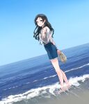  1girl barefoot beach black_hair black_shirt blue_sky blush denim denim_shorts dutch_angle earrings epitaph_(1122) foreshortening highres horizon idolmaster idolmaster_million_live! jewelry kitazawa_shiho long_hair looking_at_viewer looking_to_the_side outdoors reaching_towards_viewer see-through see-through_shirt shirt shorts sky smile solo stud_earrings very_long_hair wading 