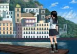  1girl black_hair black_legwear black_skirt building capelet city clouds cloudy_sky commentary_request day fubuki_(kantai_collection) hand_on_own_face highres house kantai_collection medium_hair mountain ocean pier ponytail sailor scenery school_uniform serafuku shirt shoes sidelocks skirt sky socks solo standing wasabi60 white_shirt 