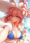  1girl :3 animal_ears beach bikini_top blue_bikini_top blue_sky blurry bow bracelet breasts cleavage closed_mouth day depth_of_field dutch_angle eyebrows_visible_through_hair eyes_visible_through_hair fate/grand_order fate_(series) food fox_ears hair_between_eyes hair_over_shoulder hat hat_bow highres horizon jewelry large_breasts long_hair looking_at_viewer neko7 orange_eyes outdoors pink_hair pinky_out popsicle sky solo sun_hat tamamo_(fate)_(all) tamamo_no_mae_(swimsuit_lancer)_(fate) upper_body 