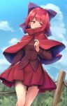  1girl bangs blue_sky blush bow capelet clouds cloudy_sky cowboy_shot day eyebrows_visible_through_hair fence hair_bow highres long_sleeves outdoors purple_bow red_eyes red_skirt redhead sekibanki short_hair skirt sky solo sweat thigh_gap touhou usotsuki_penta 