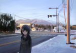  1girl blue_sky brown_eyes brown_hair car clothes_writing expressionless ground_vehicle hood hood_down hoodie house intersection kakitani_jirou looking_at_viewer motor_vehicle mountain original outdoors road short_hair sky snow solo telephone_pole town traffic_light tree twilight upper_body winter 