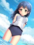  1girl antenna_hair arisu_kazumi artist_name black_hair blue_sky blue_swimsuit breasts brown_eyes clouds gluteal_fold hand_on_own_chest highres island kantai_collection long_hair looking_at_viewer mountain neck_ribbon ocean one-piece_swimsuit ribbon school_uniform serafuku sky solo swimsuit swimsuit_under_clothes ushio_(kantai_collection) 
