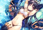  1girl amami_mikihiro armlet armpits arms_up black_hair black_legwear black_panties bow breasts cleavage closed_mouth detached_collar earrings eyebrows_visible_through_hair fate/grand_order fate_(series) gluteal_fold hair_bow hoop_earrings ishtar_(fate/grand_order) jewelry long_hair looking_at_viewer lying medium_breasts midriff navel on_back panties red_eyes single_sleeve single_thighhigh smile solo strapless thigh-highs tohsaka_rin tubetop underwear water 