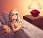  1girl :&lt; ahoge artoria_pendragon_(all) bed blue_bow boa_(4chan) bow cabinet cushion fate_(series) green_eyes hands_clasped highres lamp long_hair looking_at_viewer lying pajamas saber solo stuffed_toy 