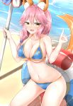  1girl animal_ears bikini blue_bikini blush breasts cleavage collarbone eyebrows_visible_through_hair fate_(series) fox_ears fox_tail holding holding_umbrella innertube large_breasts long_hair looking_at_viewer moyoron navel open_mouth pink_hair seiza sitting smile solo swimsuit tail tamamo_(fate)_(all) tamamo_no_mae_(swimsuit_lancer)_(fate) umbrella yellow_eyes 