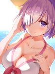  1girl arm_up bangs beach blush breasts closed_mouth collarbone day fate/grand_order fate_(series) hair_over_one_eye hand_in_hair hands_up hat highres horizon large_breasts light_smile looking_at_viewer maeshimashi ocean outdoors purple_hair shielder_(fate/grand_order) short_hair smile solo straw_hat sun_hat swimsuit violet_eyes white_swimsuit 