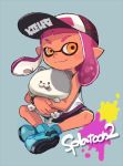  1girl bangs baseball_cap bike_shorts black_shorts blue_background blunt_bangs bracelet closed_mouth copyright_name dark_skin domino_mask full_body hat holding indian_style inkling inkling_(language) jewelry kojajji-kun_(splatoon) looking_at_viewer mask orange_eyes paint_splatter pink_hair pointy_ears print_hat riko_(sorube) shirt short_hair shorts simple_background single_vertical_stripe sitting sleeveless sleeveless_shirt smile solo splatoon splatoon_2 stuffed_animal stuffed_cat stuffed_toy tentacle_hair white_shirt 