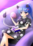 1girl alternate_hairstyle animal_ears blue_eyes blue_hair blush book breasts doremy_sweet dream_soul dress extra_ears highres legs_crossed long_hair looking_at_viewer medium_breasts multicolored multicolored_clothes multicolored_dress no_hat no_headwear oshiaki parted_lips pom_pom_(clothes) ponytail sitting solo tail tapir_ears tapir_tail touhou 