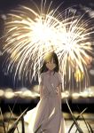  1girl bangs black_hair blurry closed_mouth depth_of_field dress eyebrows_visible_through_hair fireworks grass hair_between_eyes highres kukiha lens_flare light_smile long_hair looking_at_viewer night original outdoors short_sleeves smile solo standing white_dress 