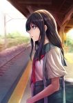  1girl bag black_hair carrying chain-link_fence cowboy_shot day fence highres kaitaku_(kt616) long_hair looking_to_the_side neckerchief original outdoors parted_lips profile red_neckerchief school_bag school_uniform serafuku shoulder_carry sidelocks sideways_mouth solo train_station train_station_platform violet_eyes 