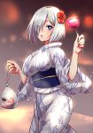  1girl bag blue_eyes candy_apple cowboy_shot eyes_visible_through_hair flower food hair_flower hair_ornament hair_over_one_eye hairclip hamakaze_(kantai_collection) hibiscus japanese_clothes kantai_collection kimono koi looking_at_viewer obi sash satchel short_hair shungikuten silver_hair solo standing white_kimono yukata 