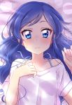  1girl aikatsu! bangs blue_eyes blue_hair blush bra_strap character_request close-up closed_mouth eyebrows_visible_through_hair hand_on_own_chest highres long_hair looking_at_viewer lying on_back on_bed sekina shirt short_sleeves solo sweatdrop upper_body wavy_mouth white_shirt 