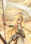  1girl armor banner blonde_hair breasts cleavage day eyebrows_visible_through_hair fate/apocrypha fate_(series) floating_hair gauntlets highres holding holding_weapon long_hair medium_breasts outdoors ruler_(fate/apocrypha) sideboob solo standing very_long_hair violet_eyes weapon 