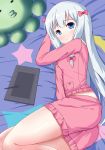  1girl absurdres bangs blanket blue_eyes bow closed_mouth crescent eromanga_sensei eyebrows_visible_through_hair frilled_shirt frilled_shorts frills from_above hair_bow highres izumi_sagiri long_hair looking_at_viewer looking_up lying on_bed on_side pajamas pink_bow pink_pajamas pink_shirt pink_shorts shirt shorts silver_hair solo star star_print stuffed_animal stuffed_octopus stuffed_toy stylus tablet tareme very_long_hair wavy_mouth xiaosamiao 