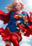  1girl animal blonde_hair blue_eyes blue_sky boots cape cat clouds covered_navel dc_comics emblem highres looking_at_viewer medium_hair midair realistic red_cape red_legwear red_skirt signature skirt sky smile stanley_lau sunlight supergirl superhero superman_(series) thigh-highs thigh_boots zettai_ryouiki 