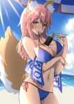  1girl animal_ears beach beach_towel between_breasts bikini blush breasts fate/grand_order fate_(series) fox_ears fox_tail large_breasts long_hair masuishi_kinoto mouth_hold pink_hair solo swimsuit tail tamamo_(fate)_(all) tamamo_no_mae_(swimsuit_lancer)_(fate) towel yellow_eyes 