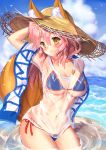  1girl animal_ears bikini blue_bikini blush breasts cleavage closed_mouth cowboy_shot day ears_through_headwear fate/grand_order fate_(series) fox_ears fox_tail hair_between_eyes highres large_breasts long_hair looking_at_viewer mogupuchi navel ocean pink_hair see-through shirt smile solo stomach swimsuit tail tamamo_(fate)_(all) tamamo_no_mae_(swimsuit_lancer)_(fate) wading wet wet_clothes wet_shirt white_shirt yellow_eyes 