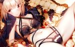  1girl apple artoria_pendragon_(all) atha_(leejuiping) bangs black_bra black_panties blonde_hair blush bra breasts cloak closed_mouth criss-cross_halter fate/grand_order fate_(series) food fruit grapes halterneck heart heart_print highres lingerie looking_at_viewer lying medium_breasts navel on_back panties saber_alter sidelocks solo thighs underwear yellow_eyes 