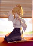  1girl arm_up barefoot black_hakama black_ribbon blonde_hair blurry blurry_background blush breasts cleavage closed_mouth day depth_of_field eyebrows_visible_through_hair fate/stay_night fate_(series) fujimura_taiga full_body hakama hip_vent indoors japanese_clothes joseph_lee kimono long_hair looking_at_viewer medium_breasts mouth_hold on_floor orange_eyes petals ribbon seiza short_hair short_sleeves sitting smile solo sunlight sword tying_hair weapon white_kimono wooden_sword 