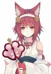  1girl animal_ears bare_shoulders blush cat_ears fire_emblem fire_emblem_heroes fire_emblem_if hairband halloween highres japanese_clothes looking_at_viewer natsuyuki nekomata pink_hair red_eyes redhead sakura_(fire_emblem_if) short_hair simple_background smile solo wand white_background 