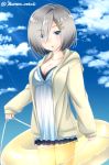  1girl alternate_costume baretto_(firearms_1) blue_eyes blue_sky breasts casual cleavage clouds cloudy_sky commentary_request hair_ornament hair_over_one_eye hairpin hamakaze_(kantai_collection) highres hood hooded_jacket innertube jacket kantai_collection looking_at_viewer parted_lips short_hair silver_hair sky solo 