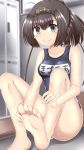  1girl absurdres akizuki_(kantai_collection) barefoot breasts brown_hair clothes_writing collarbone feet hachimaki hands_on_feet headband highres kantai_collection masa_masa name_tag ponytail school_swimsuit short_hair small_breasts smile soles solo swimsuit toes violet_eyes 