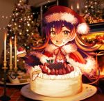 1girl :d blurry blurry_background brown_eyes brown_hair cake candle candlestand christmas christmas_tree eating fire fireplace flame food food_on_face fruit fur_trim gift hat holly ilya_(princess_connect) inside long_hair open_mouth photo_background plate princess_connect! santa_hat sitting smile strawberry tahnya 