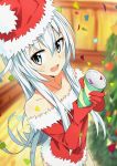  1girl :d bangs bare_shoulders blue_eyes blue_hair blurry blurry_background christmas christmas_tree commentary confetti cowboy_shot depth_of_field elbow_gloves eyebrows_visible_through_hair foreshortening fur-trimmed_gloves fur_trim gloves hair_between_eyes hat hibiki_(kantai_collection) highres holding kantai_collection long_hair looking_at_viewer open_mouth perspective red_gloves red_vest santa_costume santa_hat smile solo standing tomato_(lsj44867) vest 