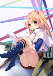 1girl american_flag_legwear azur_lane blonde_hair blush cannon capelet cleveland_(azur_lane) fingerless_gloves gloves hentai_kuwa highres kneehighs leg_hug long_hair looking_at_viewer miniskirt one_side_up panties pantyshot pantyshot_(sitting) parted_lips pleated_skirt red_eyes sitting skirt solo underwear white_panties