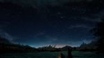  1boy aki_(aki_k6) backpack backpack_removed bag clouds commentary_request facing_away from_behind grass highres holding lantern night night_sky original outdoors scenery sky solo star_(sky) starry_sky tree valley 