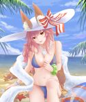  1girl animal_ears beach bikini blue_bikini blush breasts cleavage collarbone ears_through_headwear fang fate/grand_order fate_(series) fox_ears fox_tail hat highres large_breasts long_hair looking_at_viewer meo_(1271884559) navel ocean open_mouth outdoors palm_leaf palm_tree pink_hair sitting solo starfish swimsuit tail tamamo_(fate)_(all) tamamo_no_mae_(swimsuit_lancer)_(fate) tree wet yellow_eyes 