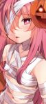  1girl bandage bandage_over_one_eye bandaged_neck blush breasts close-up cosplay fang_out halloween_costume hata_no_kokoro highres jack-o&#039;-lantern long_hair looking_at_viewer mummy mummy_(cosplay) naked_bandage navel nigo_(aozoragarou) pink_eyes pink_hair small_breasts solo touhou very_long_hair 