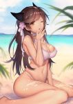  1girl animal_ears atago_(azur_lane) azur_lane bare_arms bare_legs beach between_legs bikini blue_sky blurry breasts brown_hair cleavage day depth_of_field flower hair_flower hair_ornament hair_ribbon hand_between_legs large_breasts long_hair looking_at_viewer mogullaz mole mole_under_eye navel ocean one_eye_closed orange_eyes outdoors ribbon sitting sky solo stomach summer swimsuit white_bikini yawning 