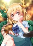  1girl antlers blonde_hair blue_shirt blush closed_mouth dragon_horns dragon_tail feet_out_of_frame green_skirt hair_between_eyes highres horns kicchou_yachie pleated_skirt red_eyes ruu_(tksymkw) shirt short_hair short_sleeves skirt smile solo tail touhou turtle_shell yellow_horns 