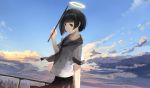  1girl black_hair brown_eyes city clouds commentary dutch_angle halo highres holding light_smile looking_at_viewer looking_to_the_side mifuru original railing school_uniform serafuku short_hair sky stick twilight wind 