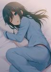  1girl ;d asashio_(kantai_collection) bangs bed_sheet black_hair blush eyebrows_visible_through_hair half-closed_eye highres kantai_collection long_hair looking_at_viewer lying nagami_yuu on_side one_eye_closed open_mouth pajamas parted_lips pillow pillow_hug sidelocks smile solo swept_bangs 