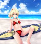  1girl bikini blonde_hair blush braid breasts clouds fate/grand_order fate_(series) french_braid front-tie_bikini front-tie_top groin hair_between_eyes highres kuro_yanagi looking_at_viewer mordred_(swimsuit_rider)_(fate) navel ocean ponytail red_scarf red_scrunchie saber_of_red sand scarf side-tie_bikini sideboob small_breasts smile solo surfboard swimsuit water 