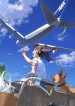  1girl :d aircraft airplane animal arm_at_side bag bicycle bicycle_basket blue_ribbon blue_shorts blue_sky blurry blush brown_eyes brown_hair buckle collar commentary_request day depth_of_field dog floating_hair from_behind from_below ground_vehicle hair_ribbon hand_up highres holding long_hair open_mouth original outdoors pairan paper_airplane ribbon shirt shopping_bag short_sleeves shorts sideways_mouth sky smile solo spring_onion sweatband twintails white_shirt wind 
