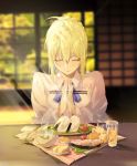  1girl ahoge artoria_pendragon_(all) bangs blonde_hair blue_ribbon braid chopsticks closed_eyes closed_mouth commentary_request e_(h798602056) eyebrows_visible_through_hair fate/stay_night fate_(series) food french_braid hair_between_eyes hair_ribbon hands_together highres indoors neck_ribbon own_hands_together ribbon saber shirt short_hair sidelocks sitting solo upper_body white_shirt 