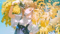  1girl :o ashima_(roro046) black_skirt blonde_hair camera collarbone commentary_request day digital_camera double_bun earrings green_eyes hair_between_eyes hair_bun high-waist_skirt highres holding holding_camera jewelry long_hair looking_at_viewer original outdoors parted_lips shirt short_sleeves signature skirt solo stud_earrings suspender_skirt suspenders tree upper_body white_shirt wide_sleeves 