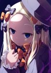  1girl abigail_williams_(fate/grand_order) bangs black_bow black_dress black_hat blonde_hair blue_eyes bow closed_mouth commentary_request dress fate/grand_order fate_(series) hand_up hat long_hair long_sleeves looking_at_viewer nicoby orange_bow parted_bangs polka_dot polka_dot_bow purple_background simple_background sleeves_past_wrists solo 