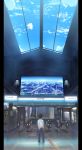  amaneko black_hair cloud clouds fare_gate highres male original real_world_location ryouma_(galley) scenery sky train_station 