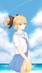  absurdres ahoge alternate_costume artoria_pendragon_(all) blonde_hair blue_sky clouds degu_guke fate/grand_order fate_(series) flower green_eyes hat hat_flower highres looking_at_viewer ocean ponytail saber saber_lily school_uniform serafuku shoreline sky straw_hat water 